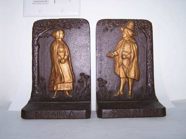 A pair of Antique Bookends circa 1900 by Bradley & Hubbard depicting John Alden (1599-1687)and his wife Priscilla who helped establish the Plymouth Colony in 1620.